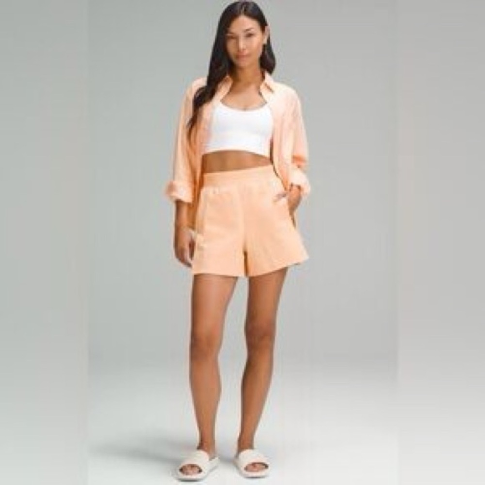 lululemon stretch woven relaxed-fit high-rise short 4 peach bellini, size medium